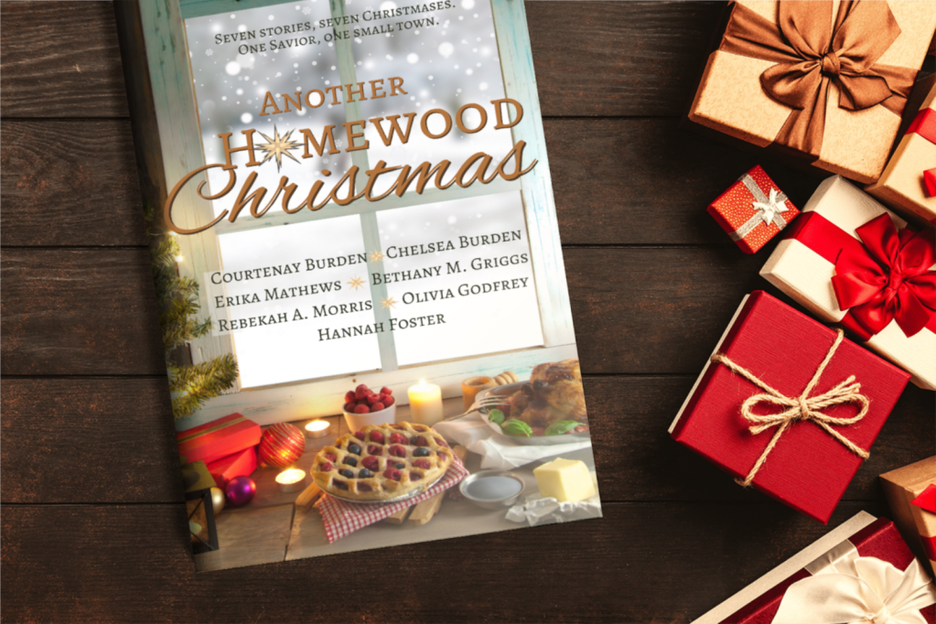 Another Homewood Christmas cover against a dark wooden table. Boxed gifts are to the side, covered in cheery red lids or bows and cozy tan string or lids.